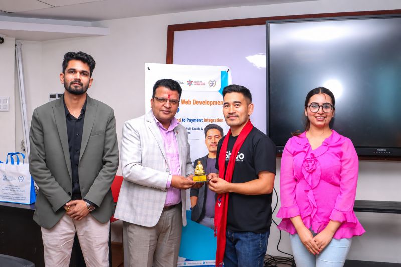 Zatil Shrestha receiving a token of appreciation after the Kathmandu Model College full stack workshop